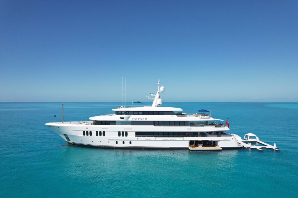 Superyacht at anchor in turquoise Bahamas water